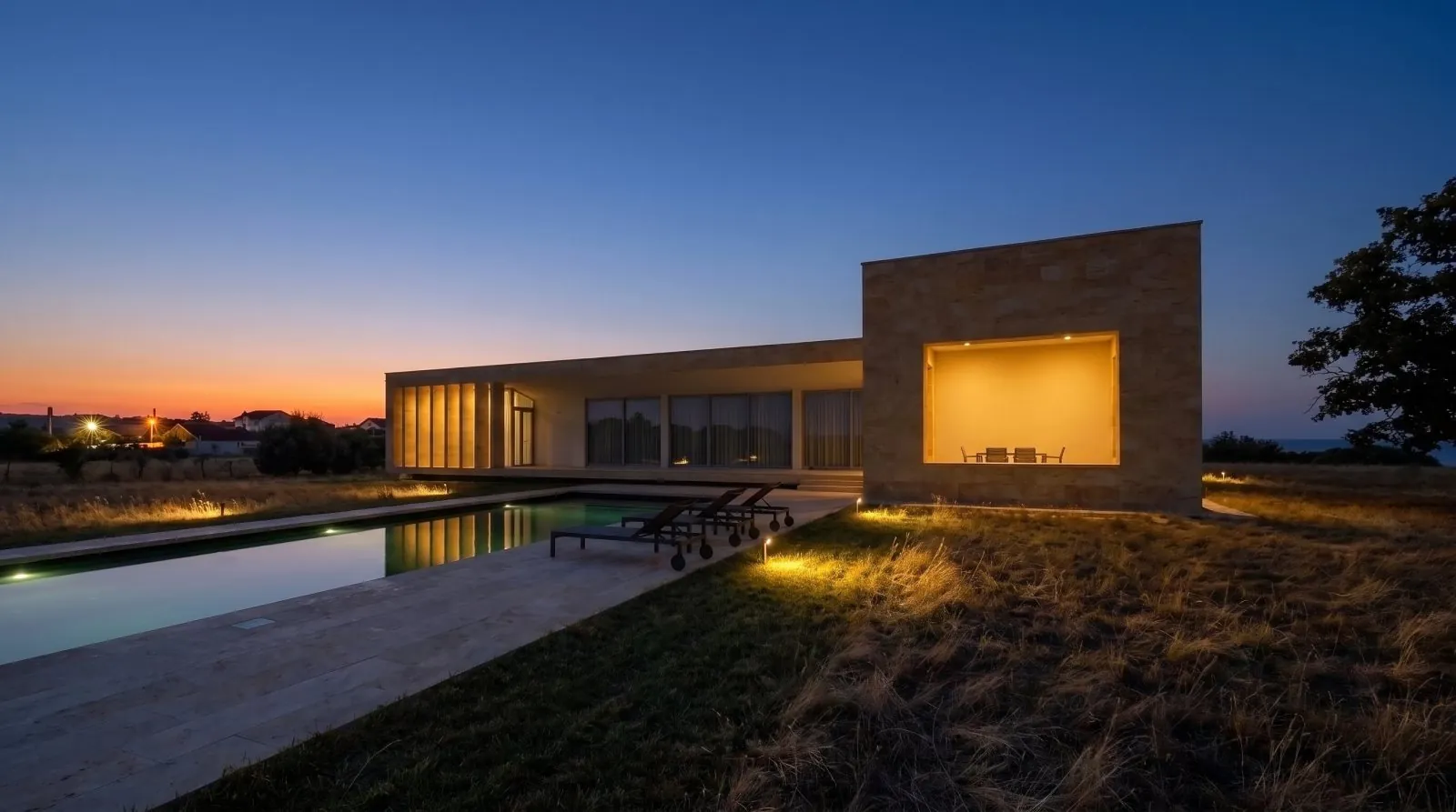 AKATSIA at night, the stone block lit from within