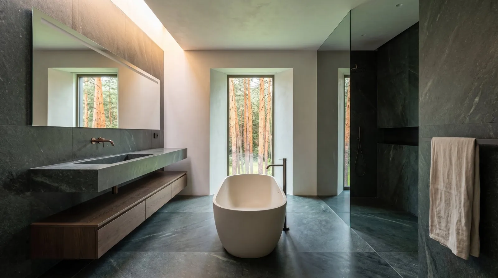 The main bathroom, smoked oak and dark stone